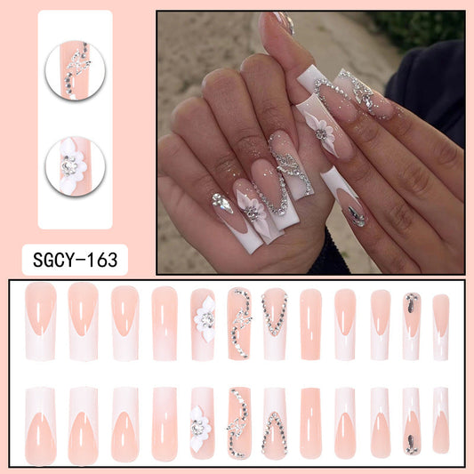 Sparkling White Floral Coffin Nails with Crystal Embellishments