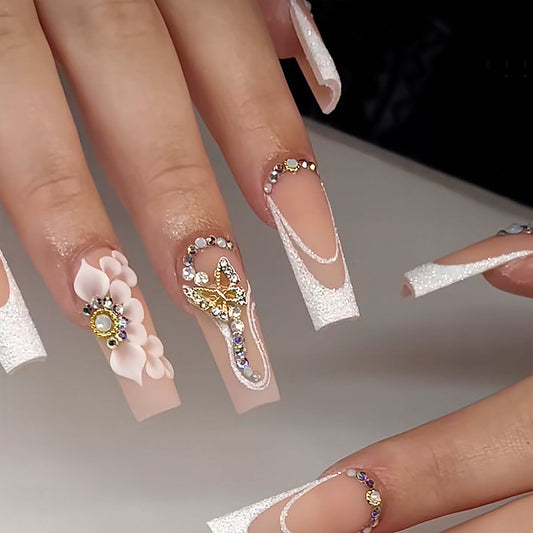 Elegant White Floral and Rhinestone Embellished Nail Art