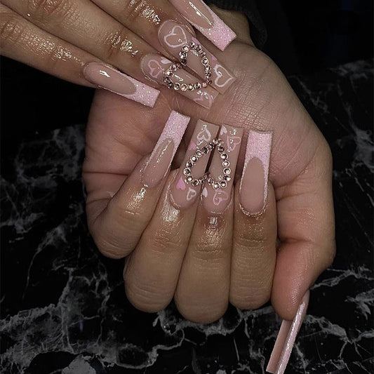 Luxurious Pink Glitter Coffin Nails with Heart Accents